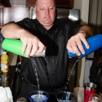 Tom Warmington serves drinks